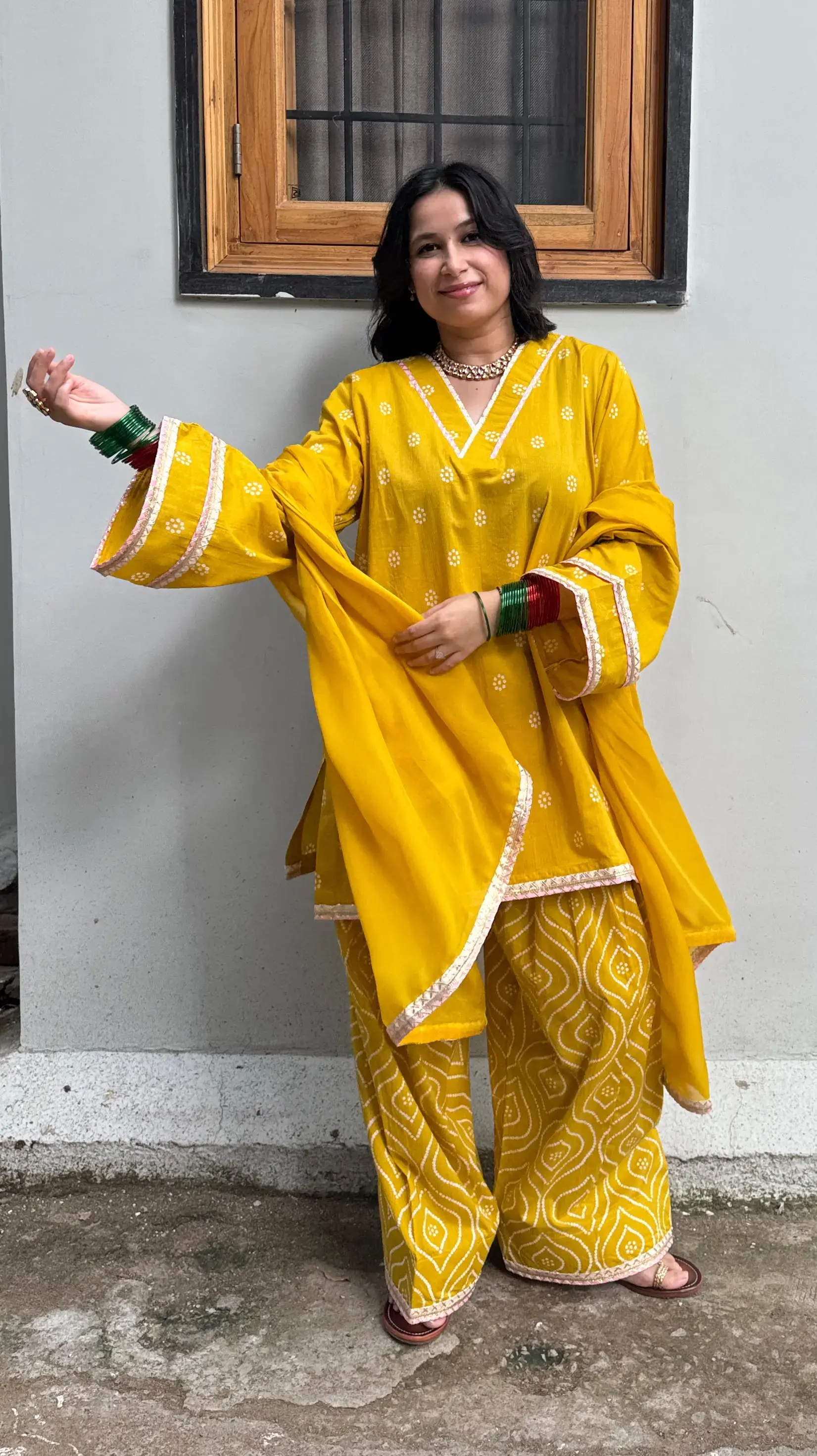 Yellow Bandhani Farshi Salwar Suit Set from Pyoor with relaxed fit, organza dupatta, and lace details for Karwa Chauth celebrations