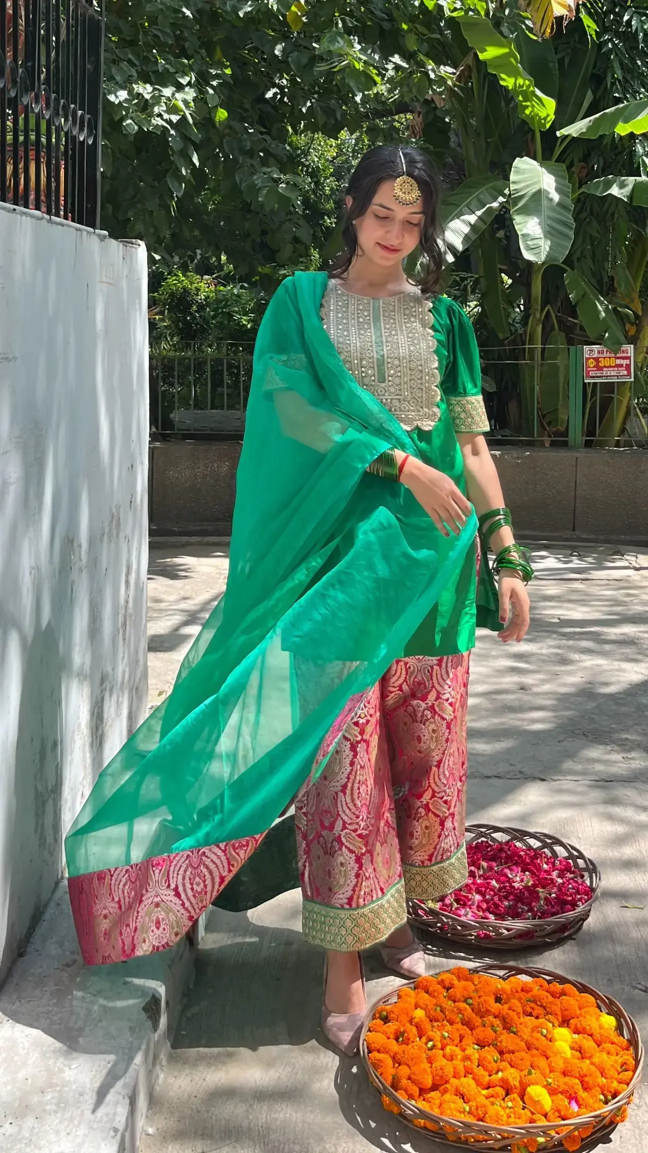 Elegant dark green suit women in silk brocade with organza dupatta for festive and cultural events