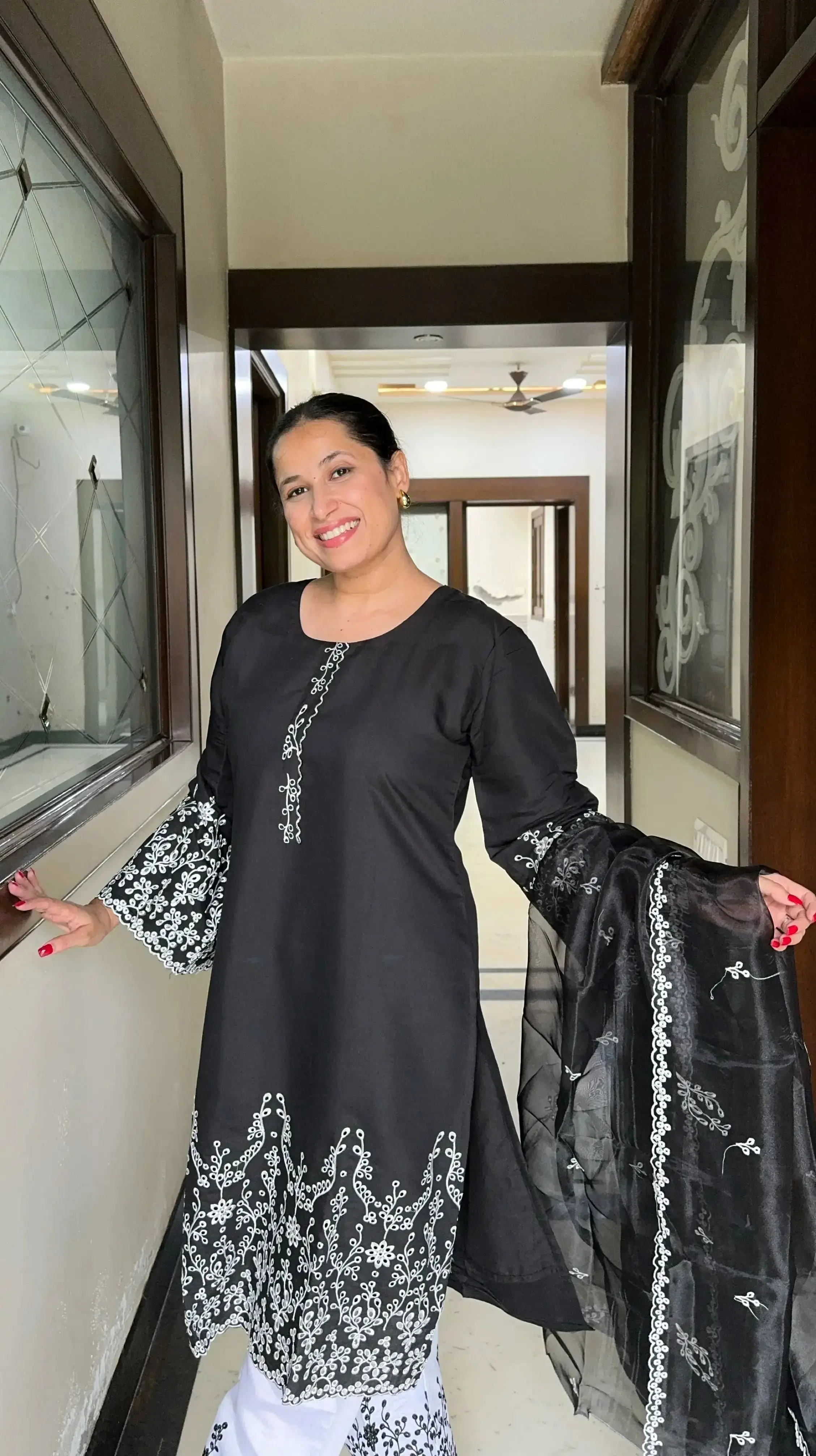 Black suit for women with embroidered sleeves and white palazzo pants from Pyoor Kalighata set