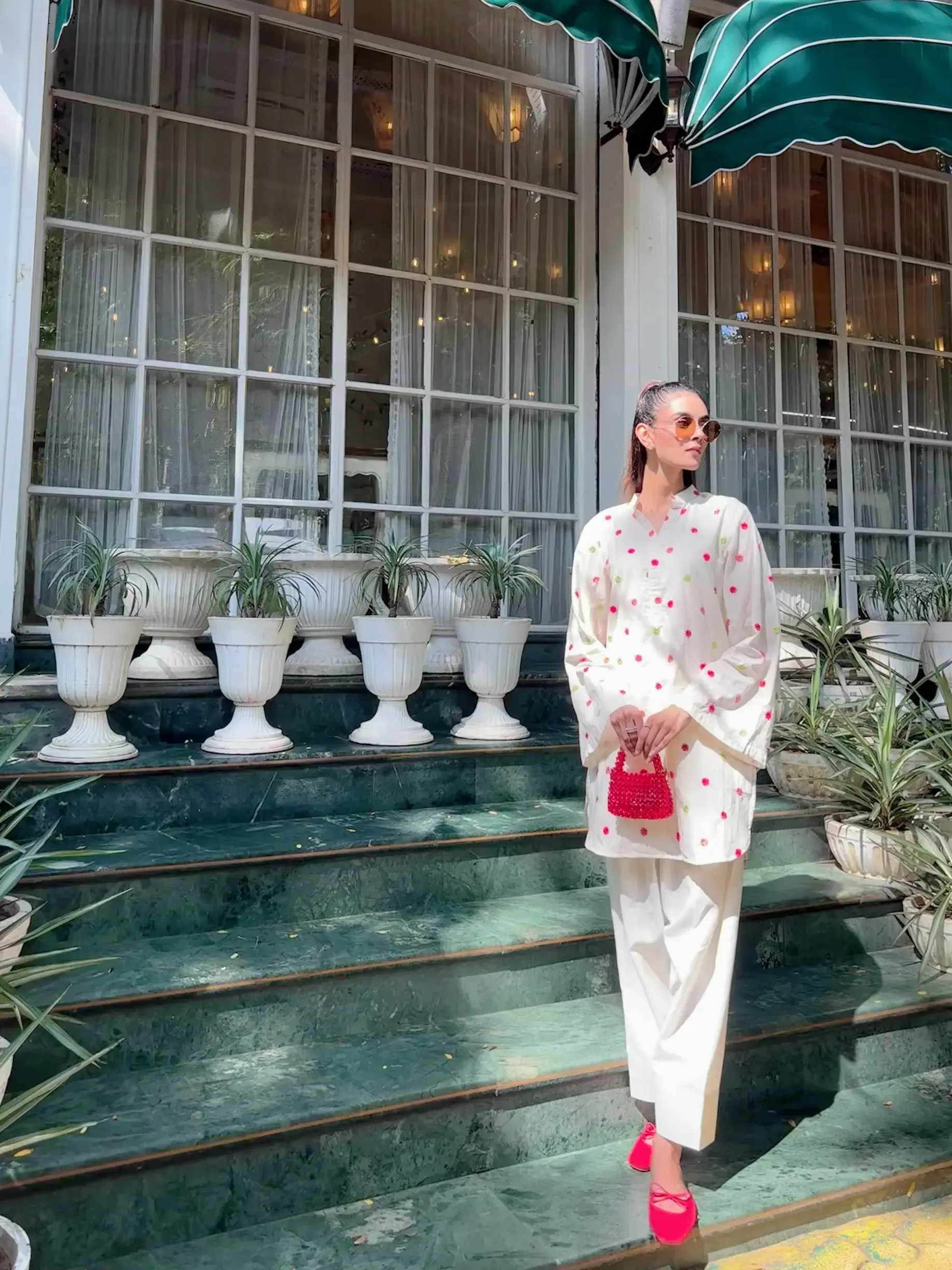 Woman wearing farshi salwar kameez in cotton with delicate embroidery for festive ethnic look